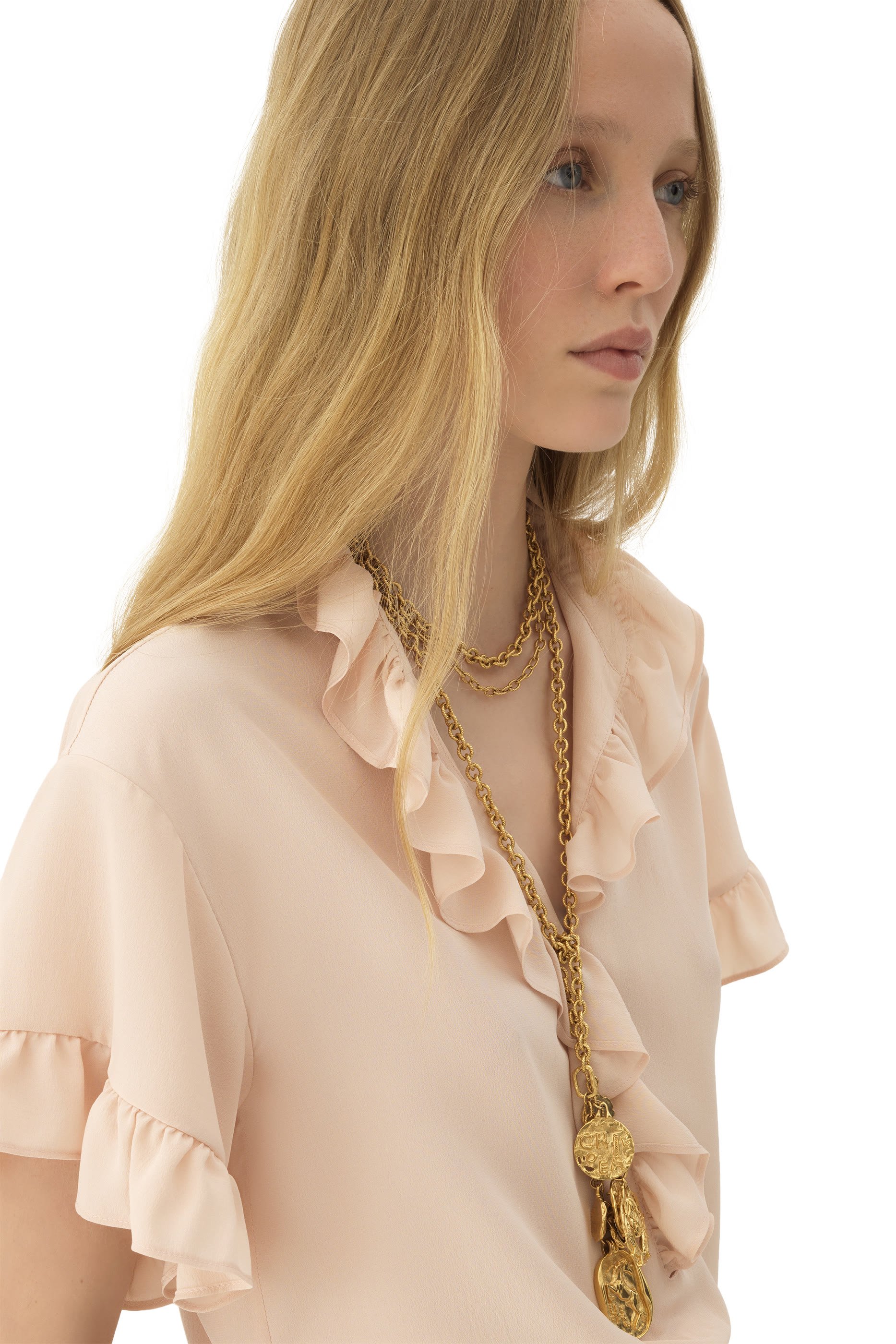 بلوزة بأكمام قصيرة مزينة بكشكش